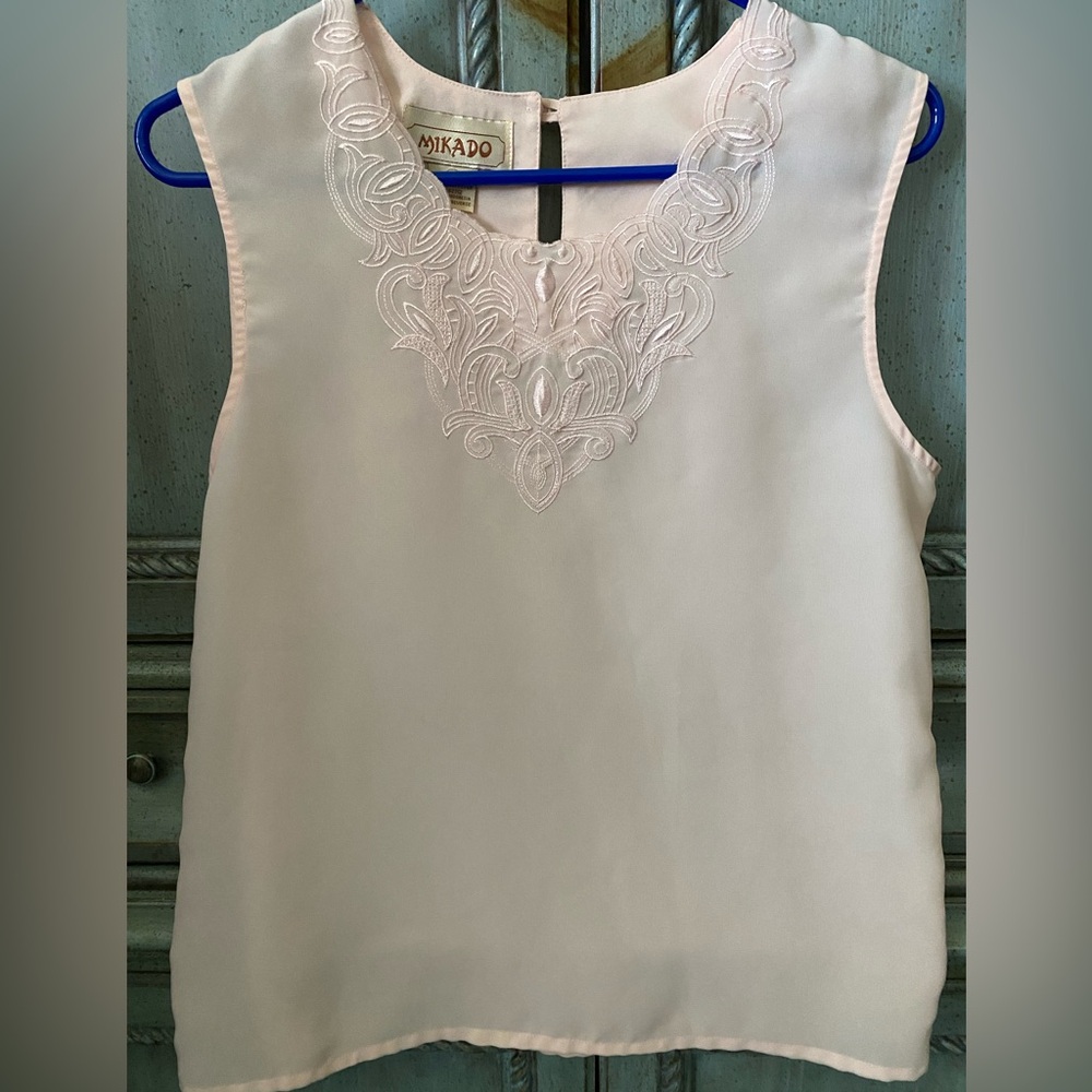 Sleeveless polyester pale peach blouse